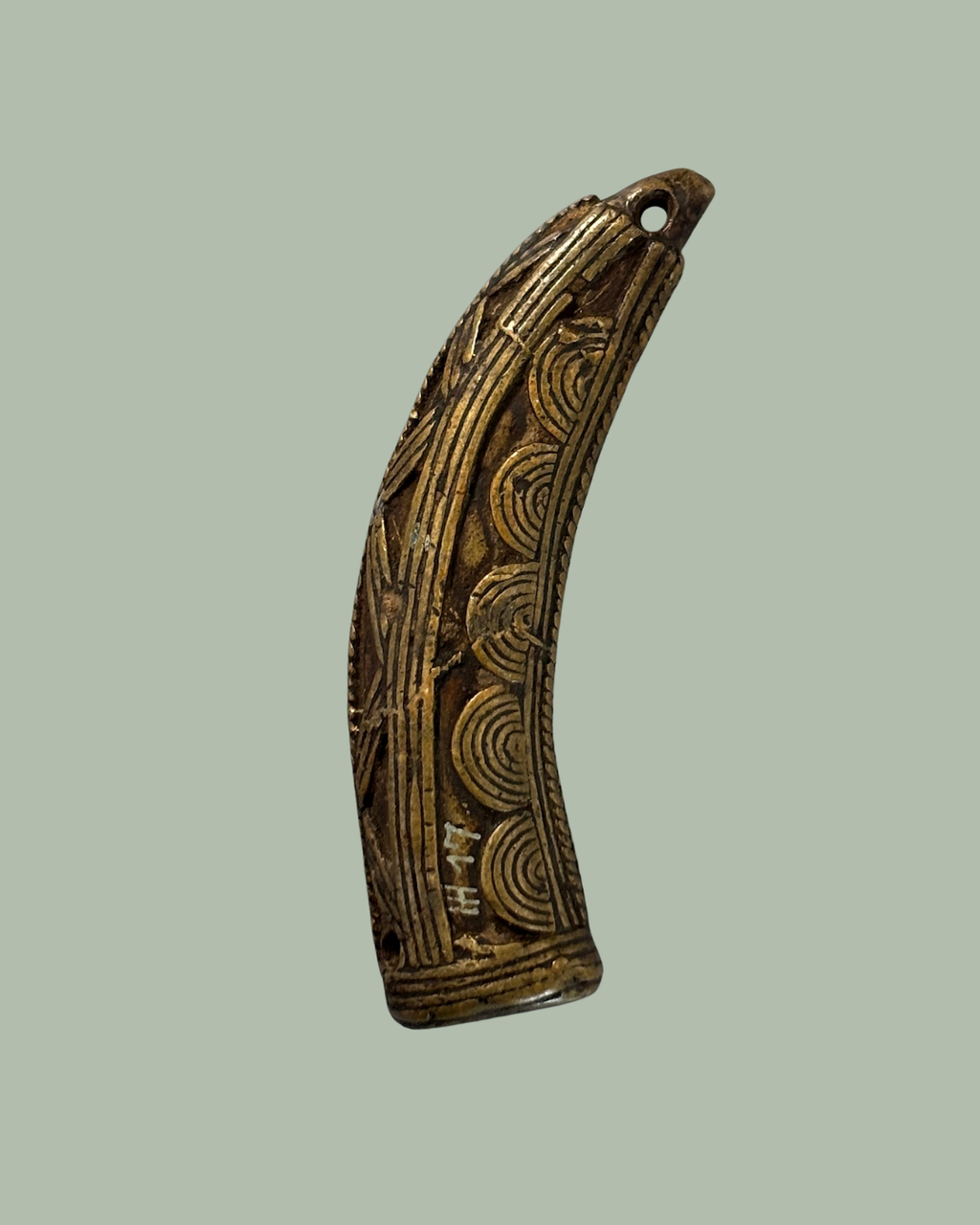 Antique Akan brass goldweight pendant from Ghana, 19th–20th century. Lost-wax cast Ashanti trade weight later worn as jewellery. Egon Guenther collection.