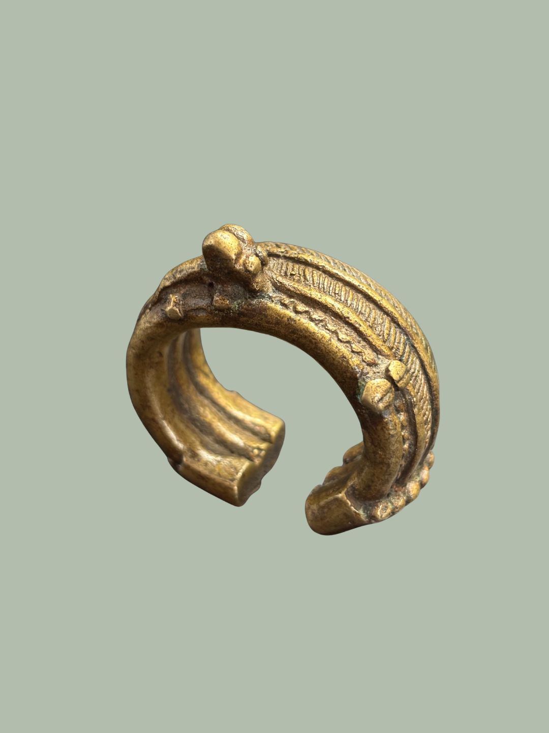 A 19TH-CENTURY YORUBA BRASS CUFF