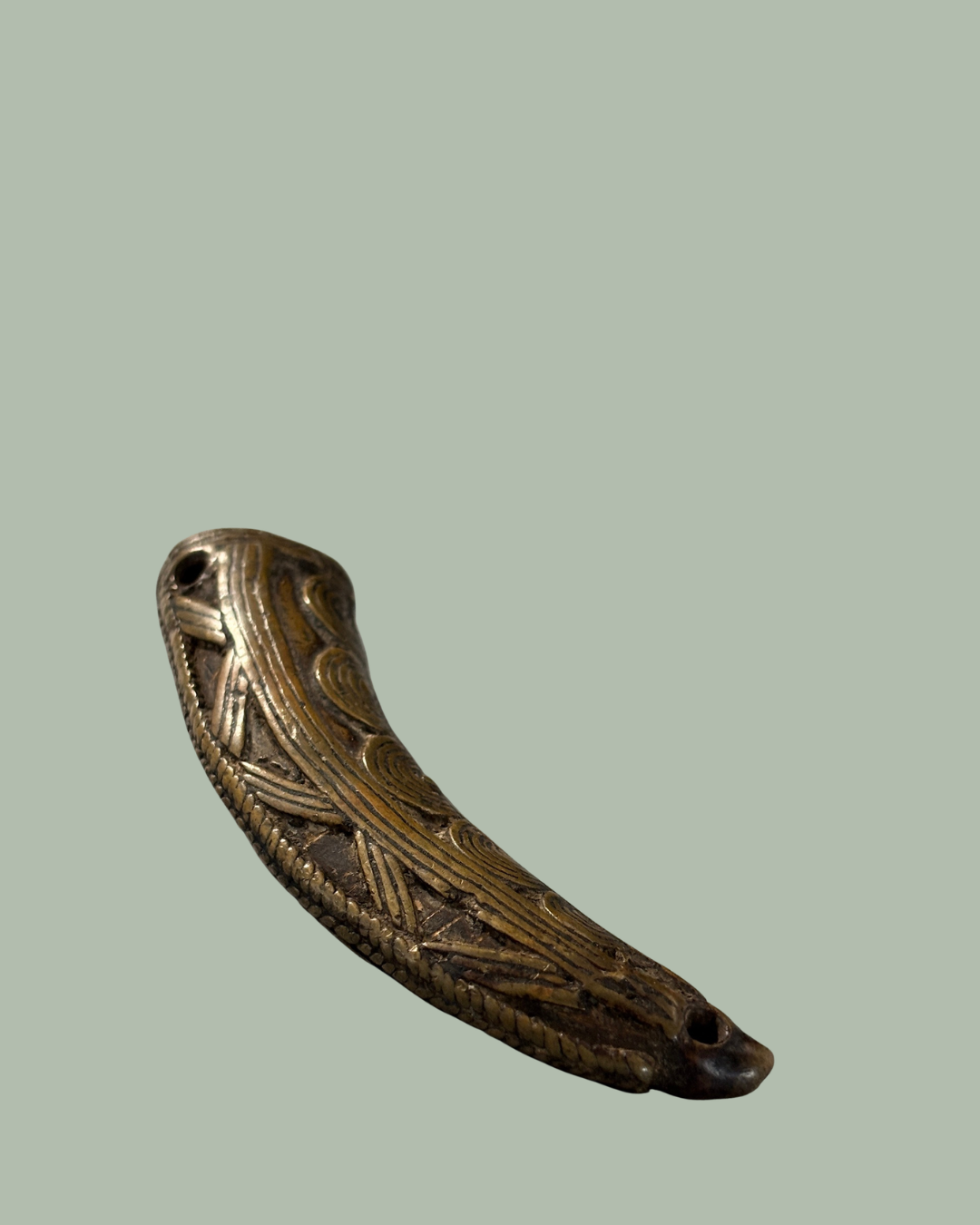 Antique Akan brass goldweight pendant from Ghana, 19th–20th century. Lost-wax cast Ashanti trade weight later worn as jewellery. Egon Guenther collection.