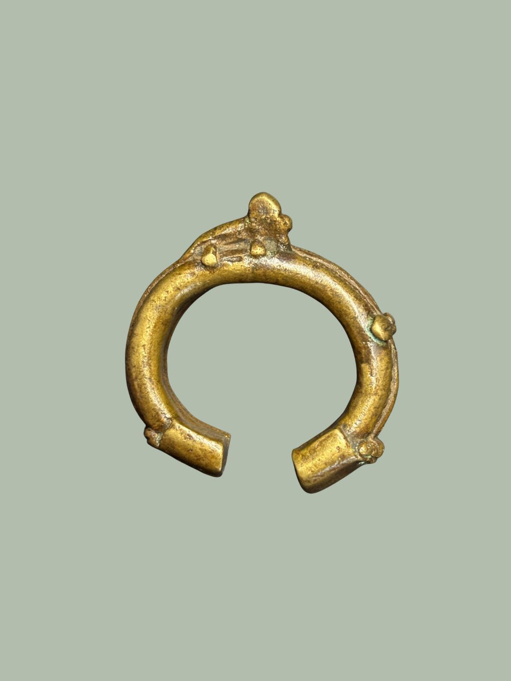 A 19TH-CENTURY YORUBA BRASS CUFF