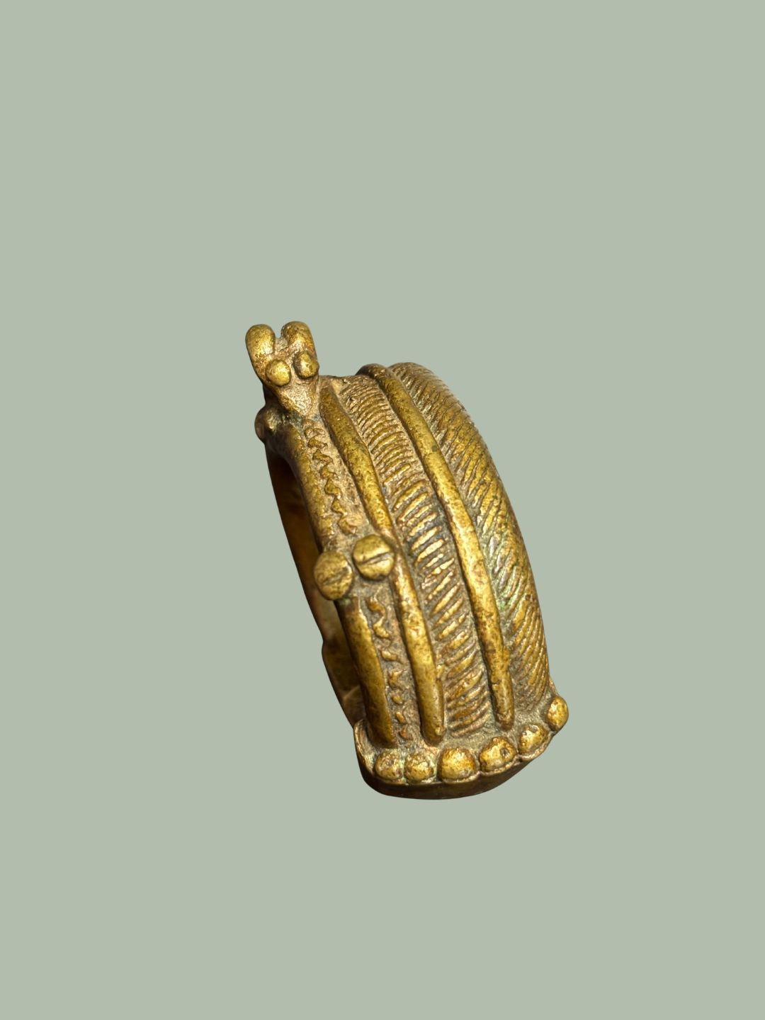 A 19TH-CENTURY YORUBA BRASS CUFF