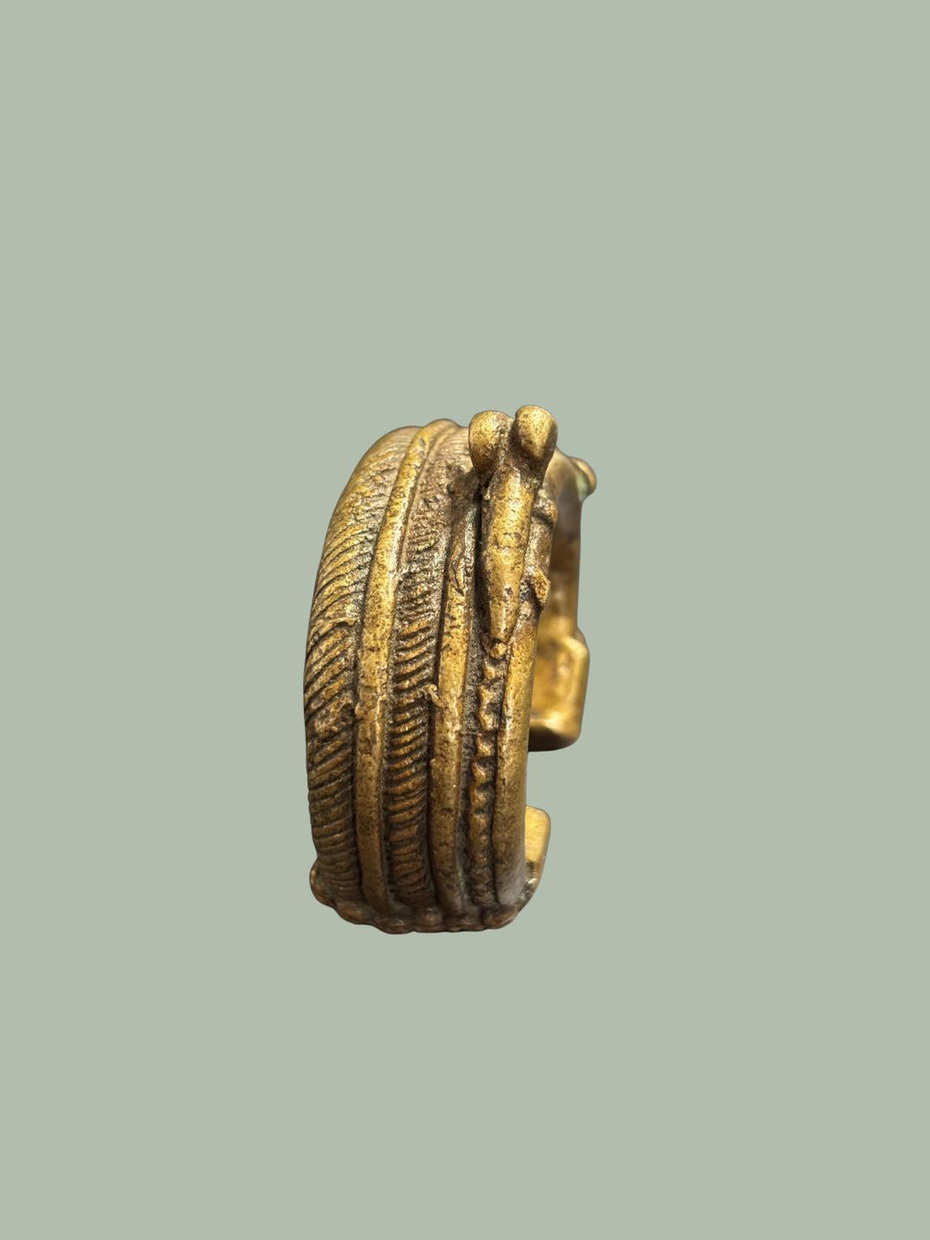 A 19TH-CENTURY YORUBA BRASS CUFF