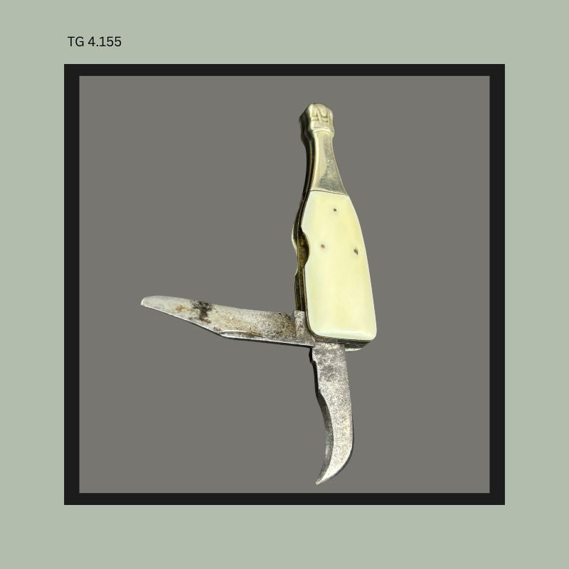Rear view champagne bottle knife with celluloid handle,