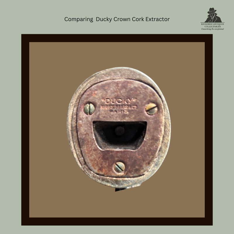 Base view of the early French Ducky crown cork extractor, showing the crown-cap lifting slot, three-screw construction and stamped “Ducky Kirkby Beard & Co Paris” maker’s marking.