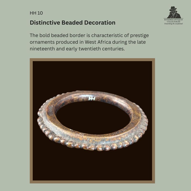 Close-up view of a West African lost-wax cast bronze prestige bracelet showing the distinctive raised beaded border characteristic of ceremonial adornments from the late nineteenth to early twentieth century, with Hans Himmelheber provenance to the Egon Guenther Collection.