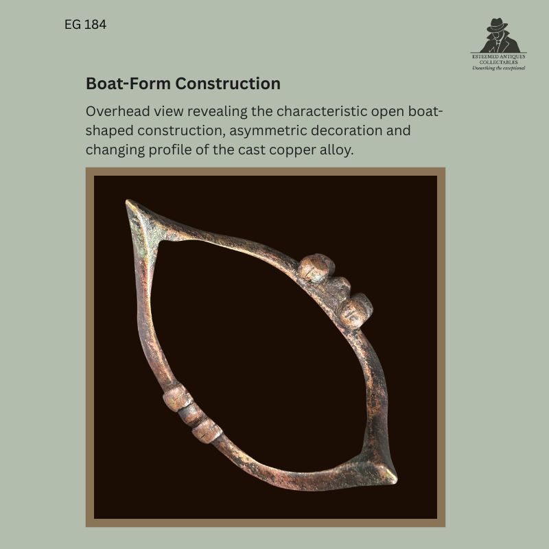 Senufo-attributed boat-form copper-alloy anklet from Côte d’Ivoire, with strongly upturned terminals, raised central bands and aged patinated surface, Egon Guenther Collection, reference EG 184.
