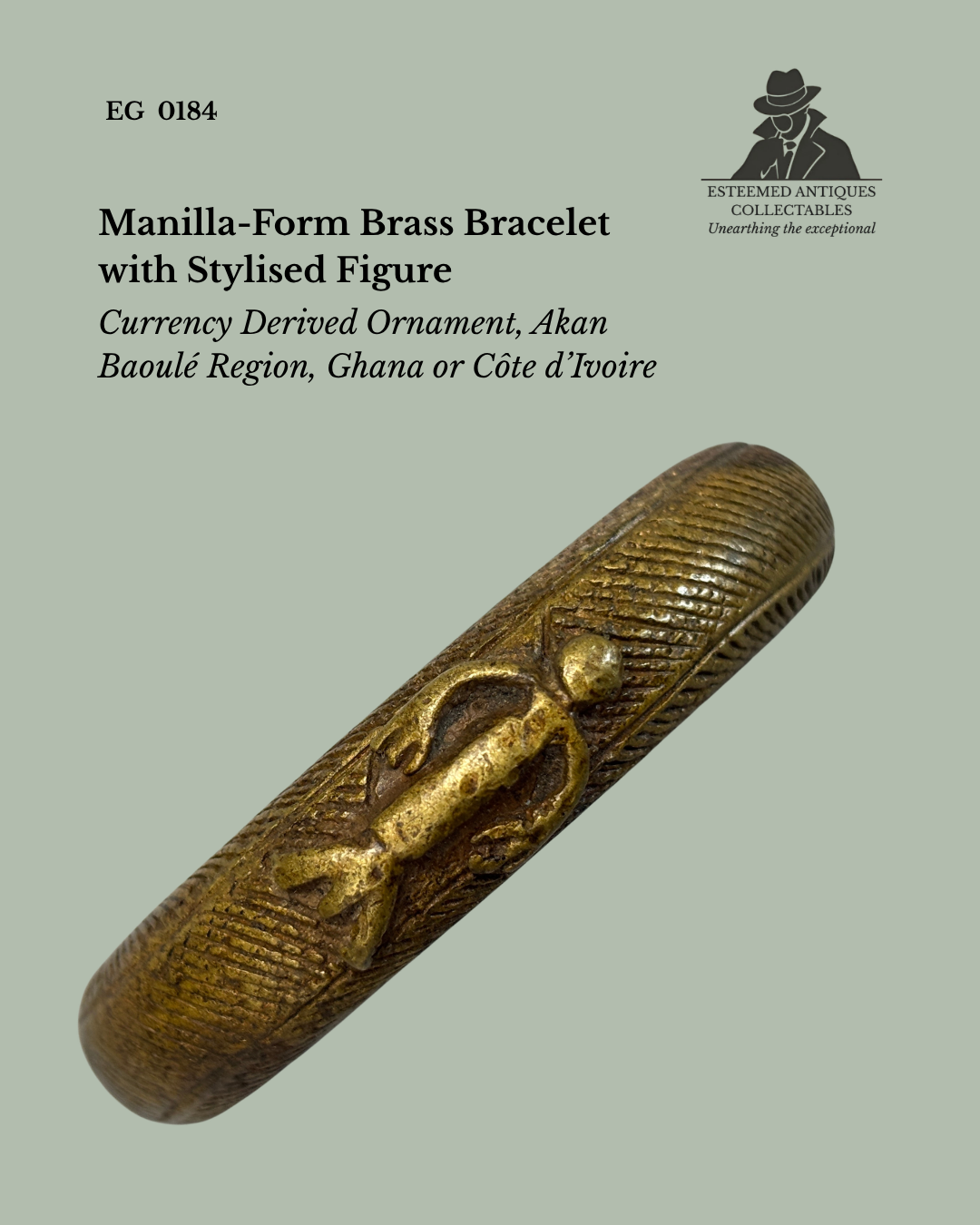 Angled view of a cast brass manilla-form bracelet with finely incised decoration and an applied stylised human figure, attributed to the Akan–Baoulé region of Ghana or Côte d’Ivoire. Originally derived from West African currency forms, from the Egon Guenther Collection.