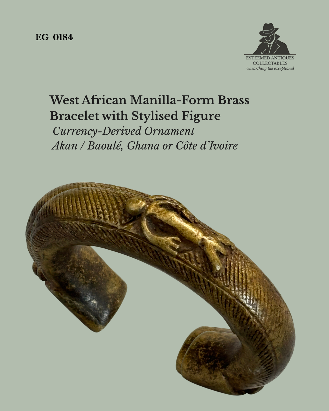 Oblique view of a West African cast brass manilla-form bracelet with finely incised decoration and a stylised human figure in relief, attributed to Akan or Baoulé traditions of Ghana or Côte d’Ivoire, a currency-derived ornament from the Egon Guenther Collection.