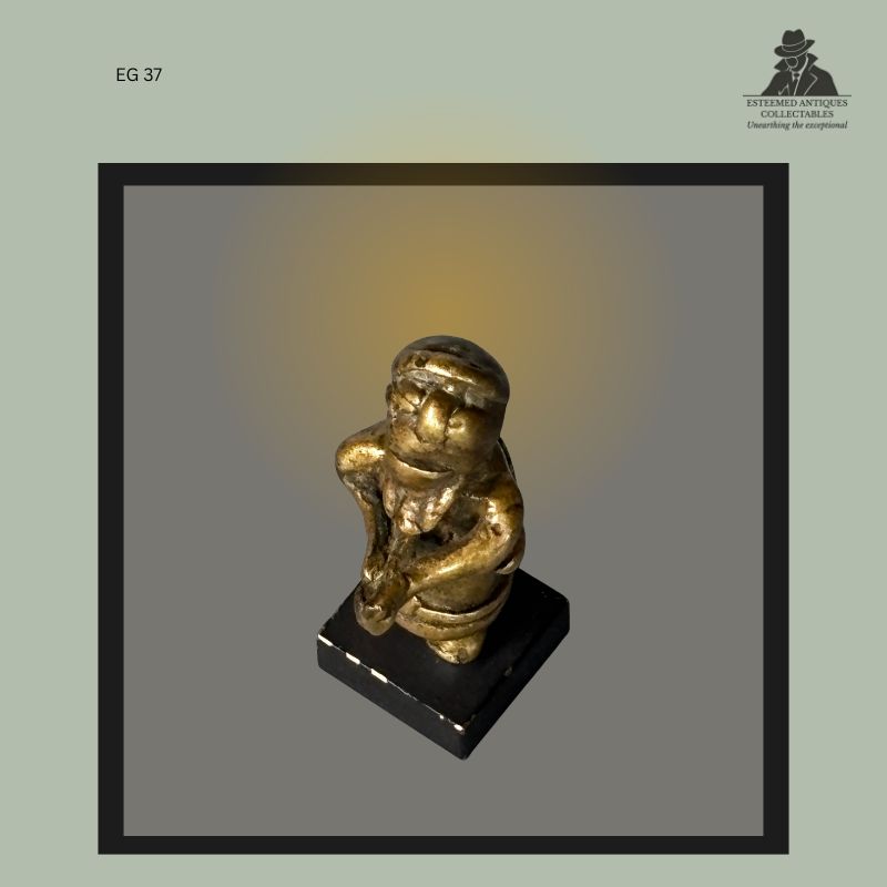 Akan lost-wax cast brass goldweight depicting a male figure with praying hands, Ghana, used within the historic gold trade system, from the Egon Guenther Collection and later the Thomas Guenther Collection.