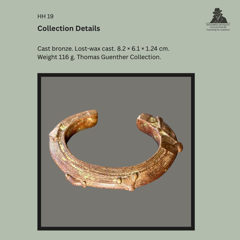Collection details slide showing an Akan-attributed cast bronze prestige bracelet produced by the lost-wax casting process, Ghana or Côte d'Ivoire, early 20th century, with measurements, weight, and Thomas Guenther Collection provenance.