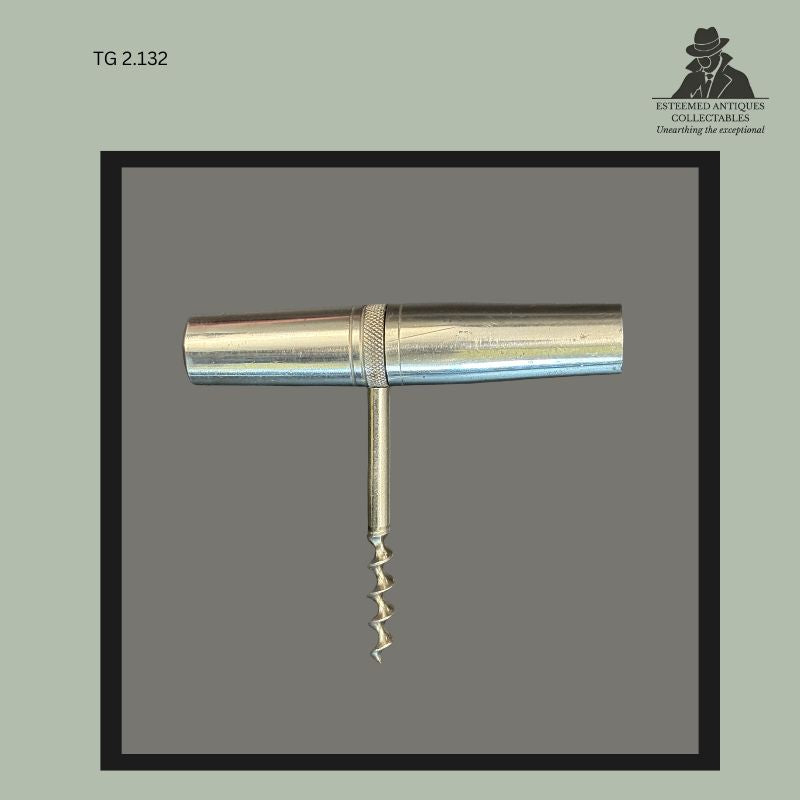 Antique metal T-form corkscrew accessory from the Universal Portable Tool Chest retailed by Sole Agents Allkin & Co Ltd, featuring a cylindrical nickel-plated metal handle with central steel worm and knurled grip section, South Africa, early 20th century.