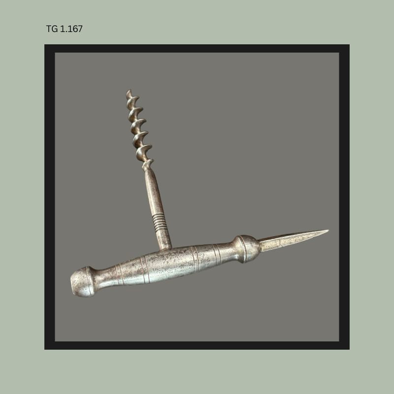 Antique metal T-handle corkscrew with integrated pointed spike, featuring a turned cylindrical handle and steel worm, likely European manufacture, early 20th century collector corkscrew form from the Thomas Guenther Collection.