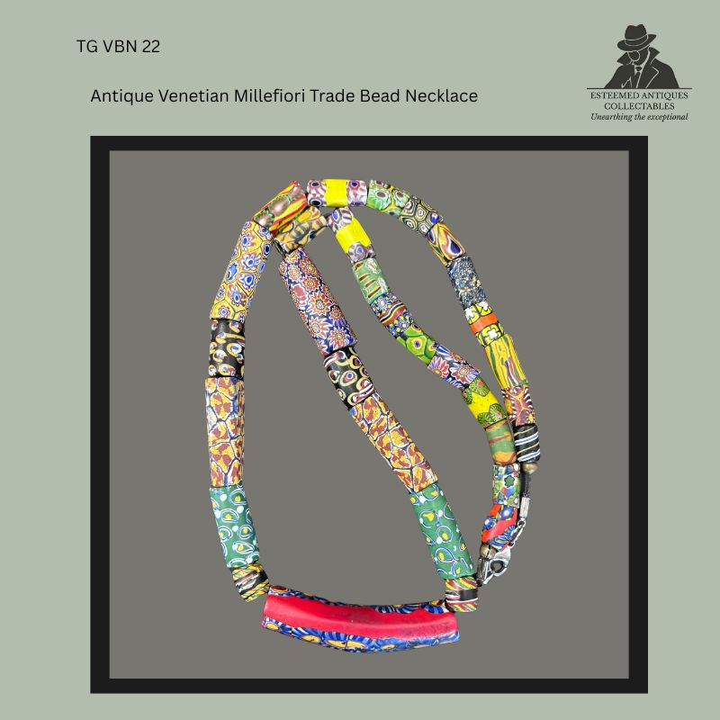 Restrung antique Venetian millefiori glass trade bead necklace composed of mixed mosaic cane beads, including long cylindrical and tubular examples with multicoloured floral, geometric and eye motifs, finished with a modern clasp, from the Thomas Guenther Collection.