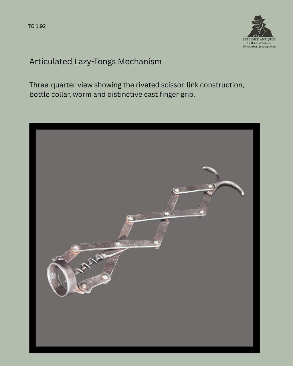 Detail view of the articulated zig-zag corkscrew mechanism, showing the linked metal arms, pivot joints and mechanical construction.