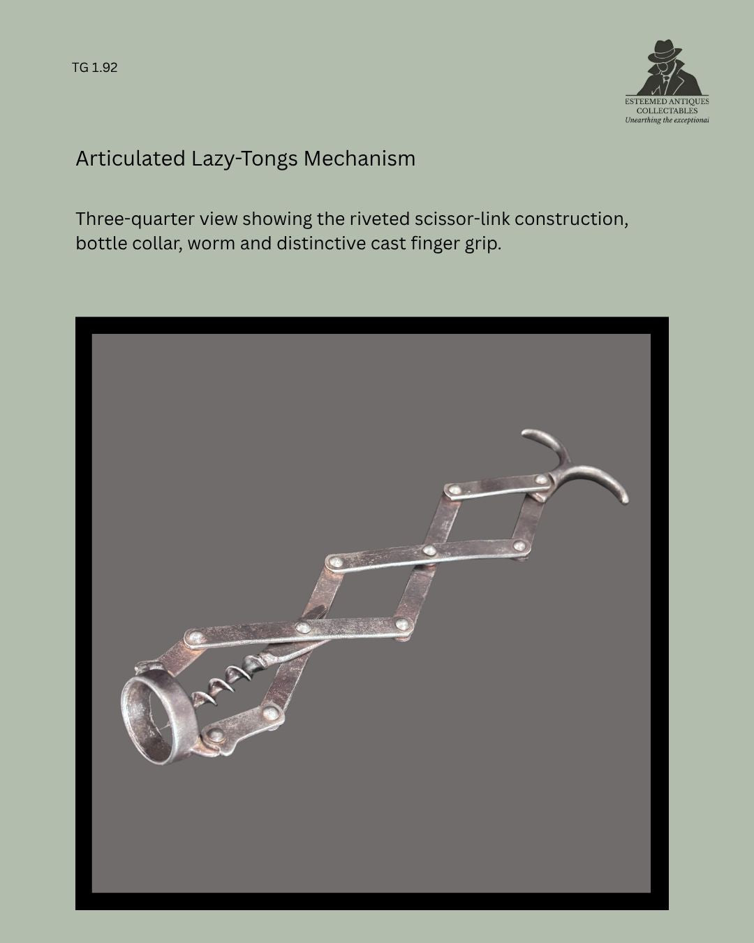 Detail view of the articulated zig-zag corkscrew mechanism, showing the linked metal arms, pivot joints and mechanical construction.