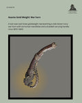 Catalogue panel showing an Asante lost-wax-cast brass goldweight representing a side-blown ivory war horn with six human mandibles and a braided carrying handle, Ghana, circa 1870–1920, reference EG AGW 09.