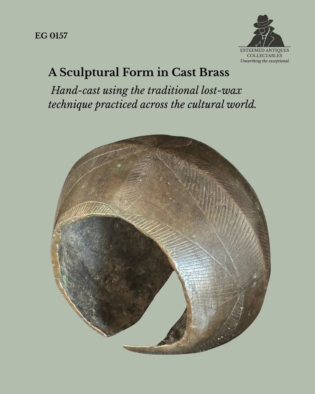 Baoulé cast brass open anklet from Côte d'Ivoire, hand-cast using the traditional lost-wax process with engraved geometric decoration across the broad curved body, from the Egon Guenther Collection.