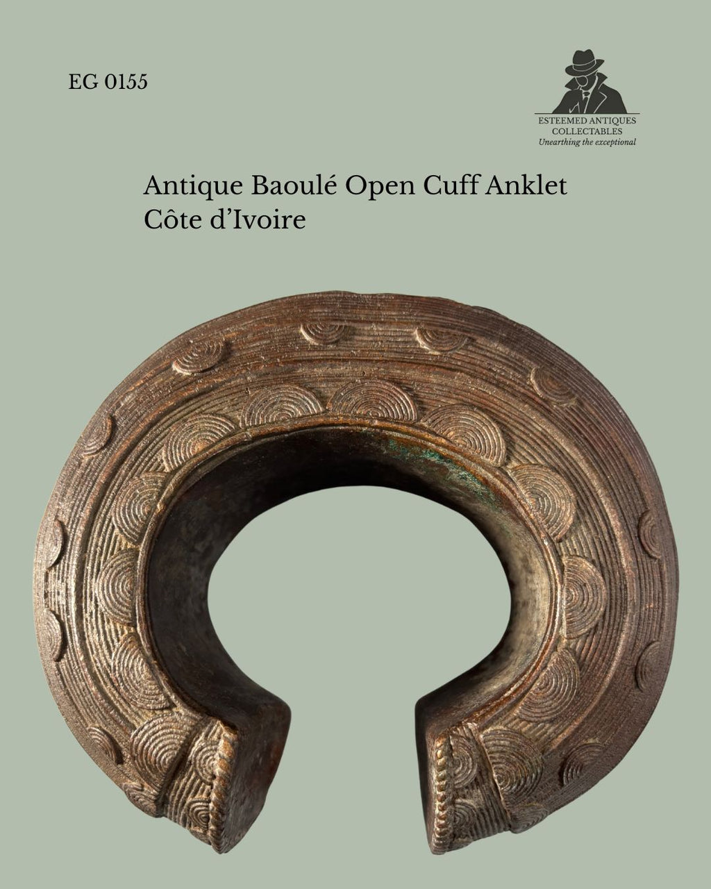 Antique Baoulé open cuff anklet from Côte d’Ivoire, cast bronze with finely incised concentric circular decoration and an open-front form, shown from above. Provenance: Egon Guenther Collection.