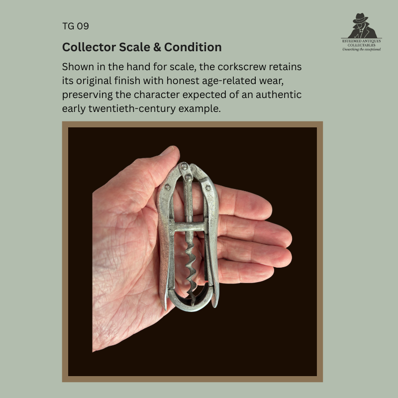 Brevetti Vogliotti double-lever aluminium and steel corkscrew shown in the hand for scale, illustrating the compact size, original finish, honest age-related wear, and overall collector condition of this Italian example dating to the early twentieth century.