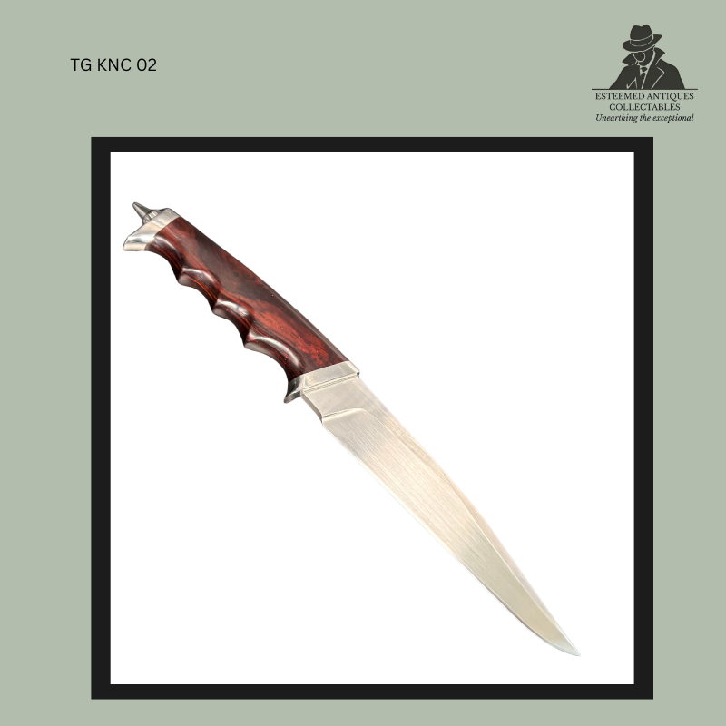 Reverse view of a handmade Burger fixed-blade hunting knife showing a polished steel blade, sculpted reddish hardwood handle with deep finger grooves, and a stainless steel wolf head pommel, photographed against a plain background.
