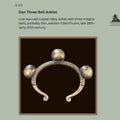 Dan three-bell lost-wax cast copper-alloy anklet from western Côte d’Ivoire, late 19th to early 20th century, with three integral spherical bells and ribbed penannular body, Egon Guenther Collection.