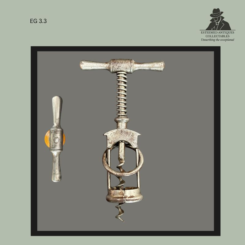 Early Columbus corkscrew marked D.R. PATENT No. 70879, displaying the patented split-frame extraction system, circular guide ring, and cast metal handle associated with Eduard Becker's Solingen design.