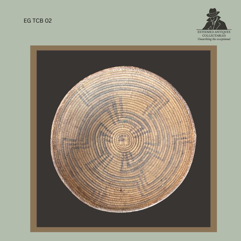 nterior view of an early Southern Tswana hand-coiled fibre basket showing tightly stitched concentric construction with dark geometric decoration radiating from the central base, from the Egon Guenther Collection.