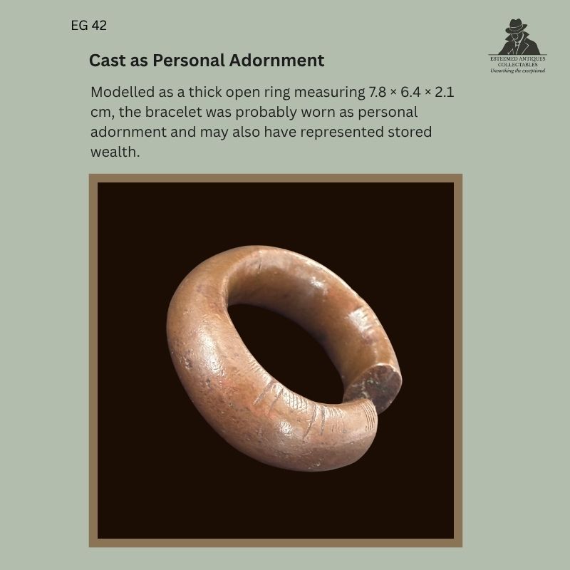 Catalogue panel showing EG 42, a thick cast copper-alloy penannular bracelet attributed to the Senufo, with an open ring form and incised decoration near one terminal.
