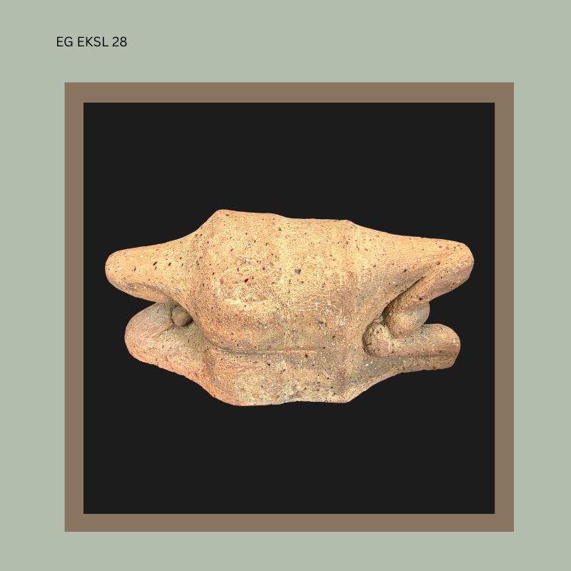 Terracotta sculptural figure attributed to South African artist Ezrom Legae, showing an abstracted crouching human form with folded limbs and heavily textured fired clay surface, from the Egon Guenther Collection.