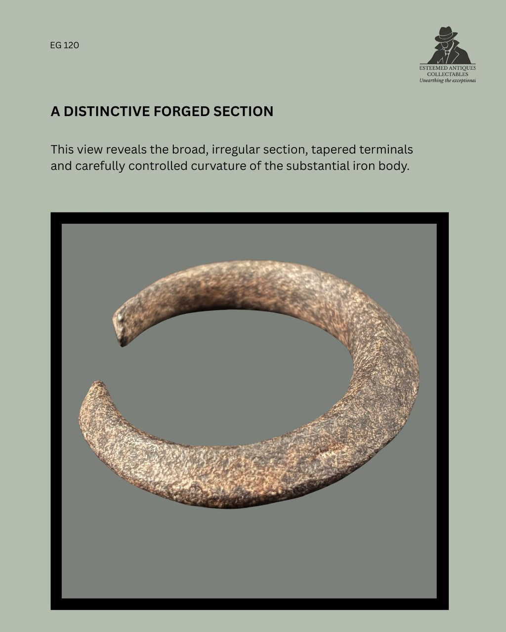Angled view of a Nigerian forged iron manilla-form currency bracelet, EG 120, showing its broad irregular section, controlled curvature and tapered open terminals.