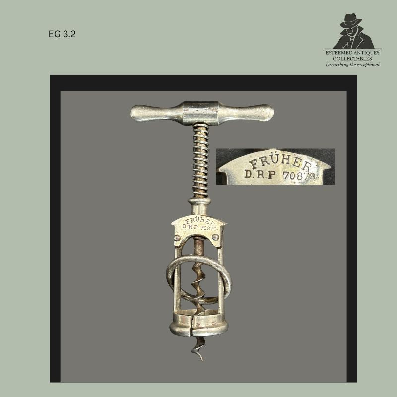 Early Columbus frame corkscrew marked FRÜHER D.R.P. 70879, featuring a metal T-handle, split-frame construction, circular guide ring, and enlarged detail of the German patent marking.