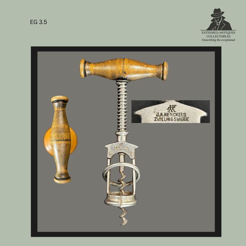 Columbus-pattern frame corkscrew bearing the J.A. Henckels Zwillingswerk mark, fitted with a turned wooden handle and featuring the patented split-frame mechanism developed in Solingen, Germany.
