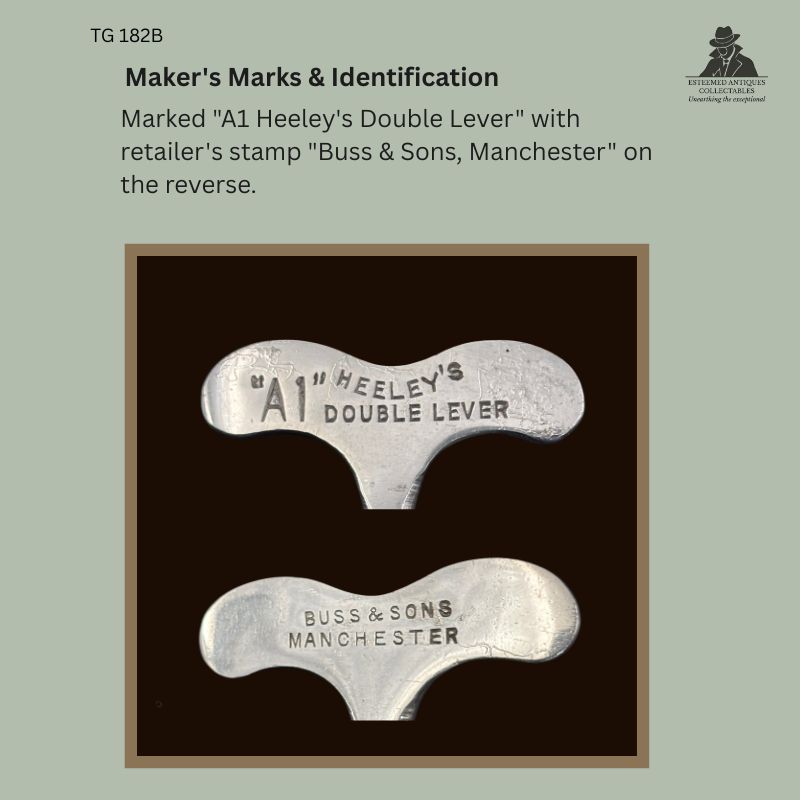 Alt text: Close-up detail showing the stamped markings on a James Heeley's A1 Double Lever corkscrew, including the maker's mark "A1 Heeley's Double Lever" and the retailer's stamp "Buss & Sons, Manchester" on the reverse of the metal handle.