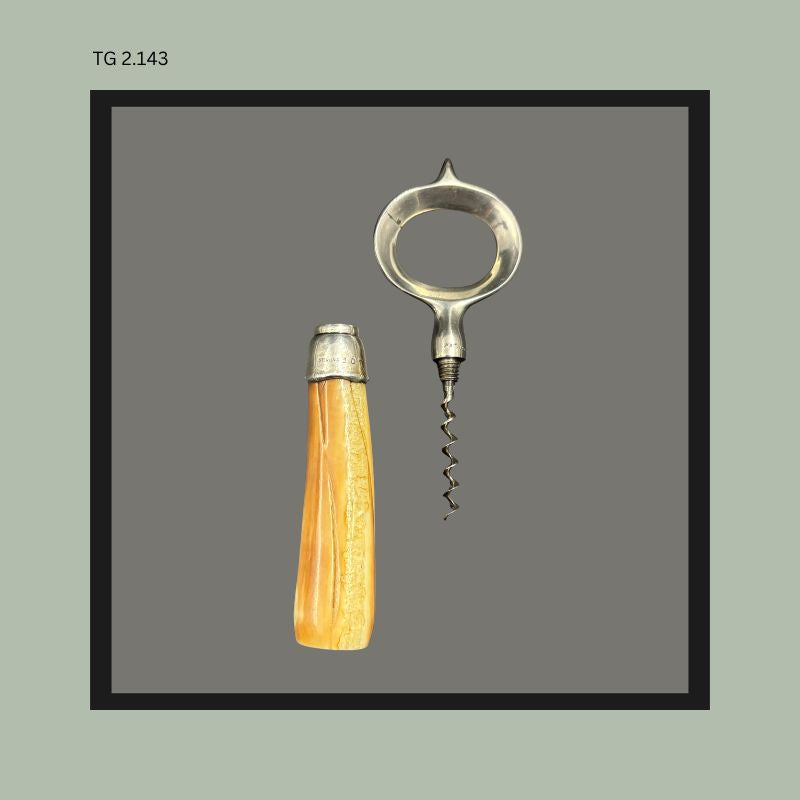ohn Hasselbring patent 1906 Baltimore Loop Seal corkscrew with removable steel worm, sterling silver mounted collar, and tapered polished horn handle, American mechanical wine antique from the Thomas Guenther Collection.
