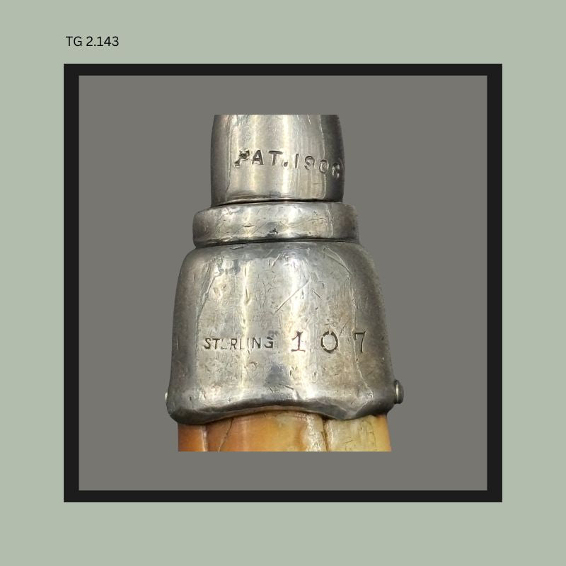 John Hasselbring patent 1906 American corkscrew with Baltimore Loop Seal opener, fitted with a sterling silver mount and tapered horn handle, showing removable steel worm construction from the Thomas Guenther Collection.
