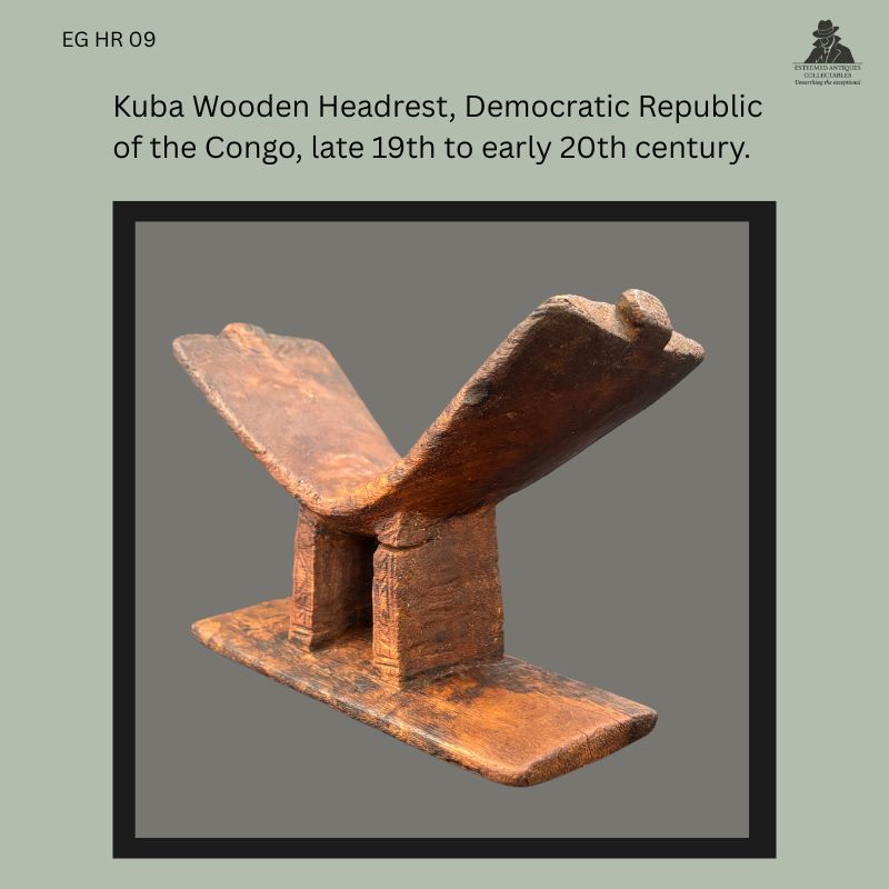 Kuba carved hardwood headrest from the Democratic Republic of the Congo, featuring a V-shaped neck support raised on two rectangular uprights above a flat rectangular base, with a rich worn patina and visible hand-carved construction, from the Egon Guenther Collection.