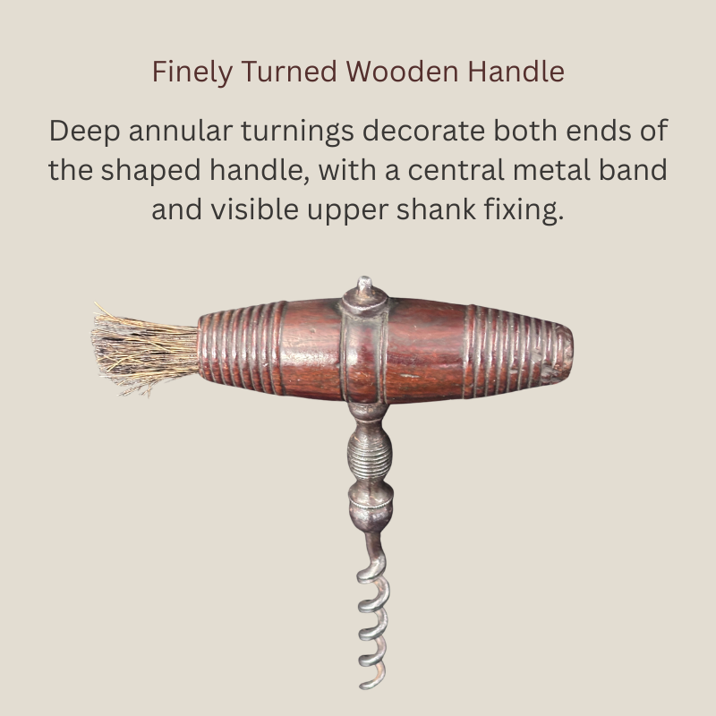 Detail of a late Victorian English straight-pull corkscrew showing the finely turned wooden T-handle, deep annular grooves, central metal band, upper shank fixing and retained natural-bristle brush.