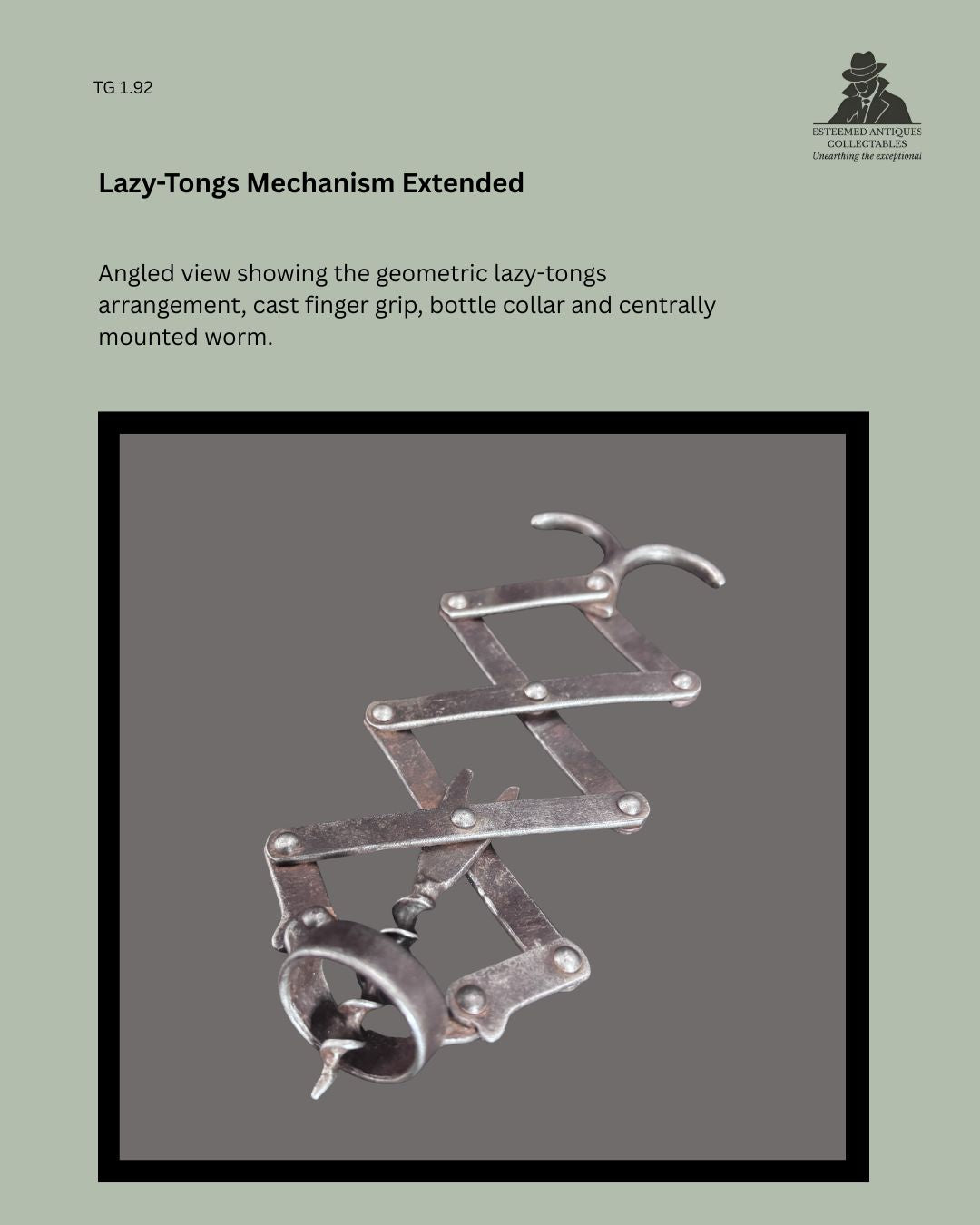 Angled view of the antique metal lazy-tongs corkscrew fully extended, showing the articulated geometric linkage, cast finger grip, bottle collar and centrally mounted worm.