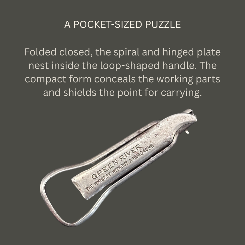 Noyes Universal steel folding corkscrew shown closed, with its worm concealed inside the loop handle and Green River Whiskey advertising visible on the hinged plate.