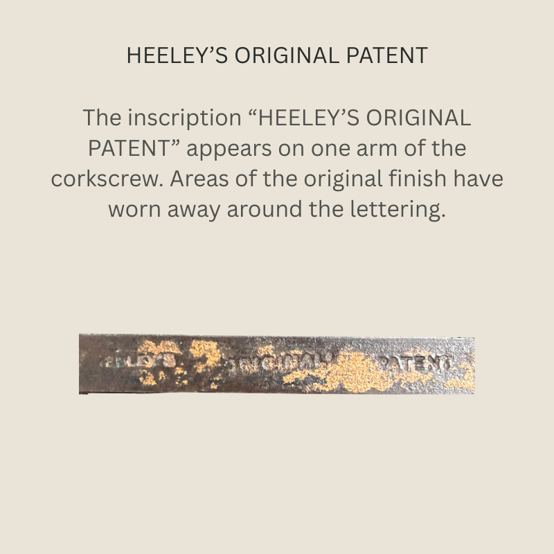 Close-up of the “HEELEY’S ORIGINAL PATENT” stamp on a steel arm of The Pullezi concertina corkscrew, showing worn surface finish around the lettering.