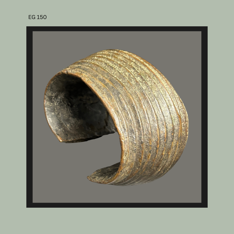 Curved section of an African earthenware vessel with finely ribbed exterior decoration and smoke-darkened interior surface, illustrating traditional hand-built ceramic construction and weathered archaeological character.