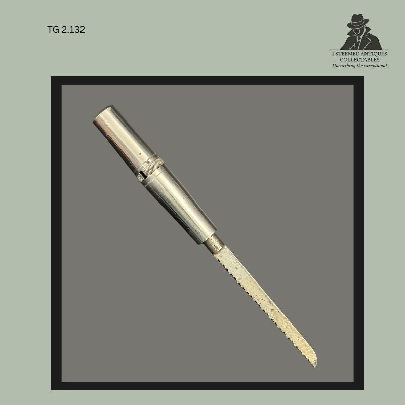 Removable fine-tooth metal saw blade with cylindrical nickel-plated handle from the Universal Portable Tool Chest, featuring a knurled locking collar and compact workshop tool construction associated with early 20th century travelling tool kits.