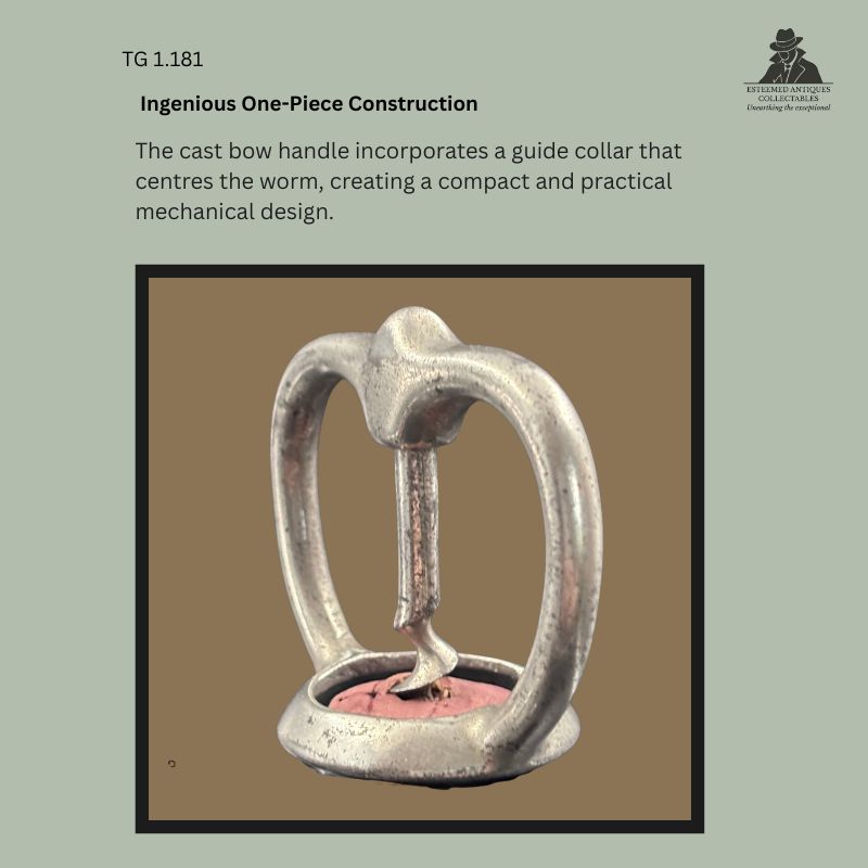 Detail view of an unmarked Magic Plants Patent corkscrew showing the one-piece cast metal bow handle with its integrated guide collar centring the steel worm, a compact mechanical design dating to the early twentieth century, circa 1905–1915.