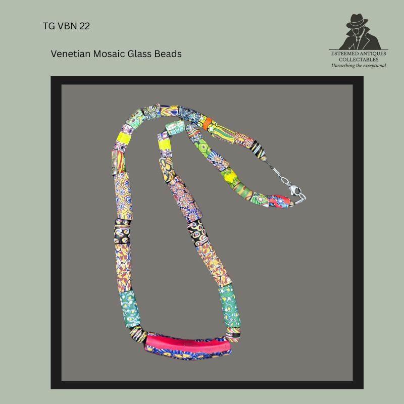 Restrung necklace composed of assorted antique Venetian millefiori mosaic glass trade beads, including cylindrical, tubular and barrel-shaped examples with multicoloured cane-work decoration, finished with a modern clasp, from the Thomas Guenther Collection.