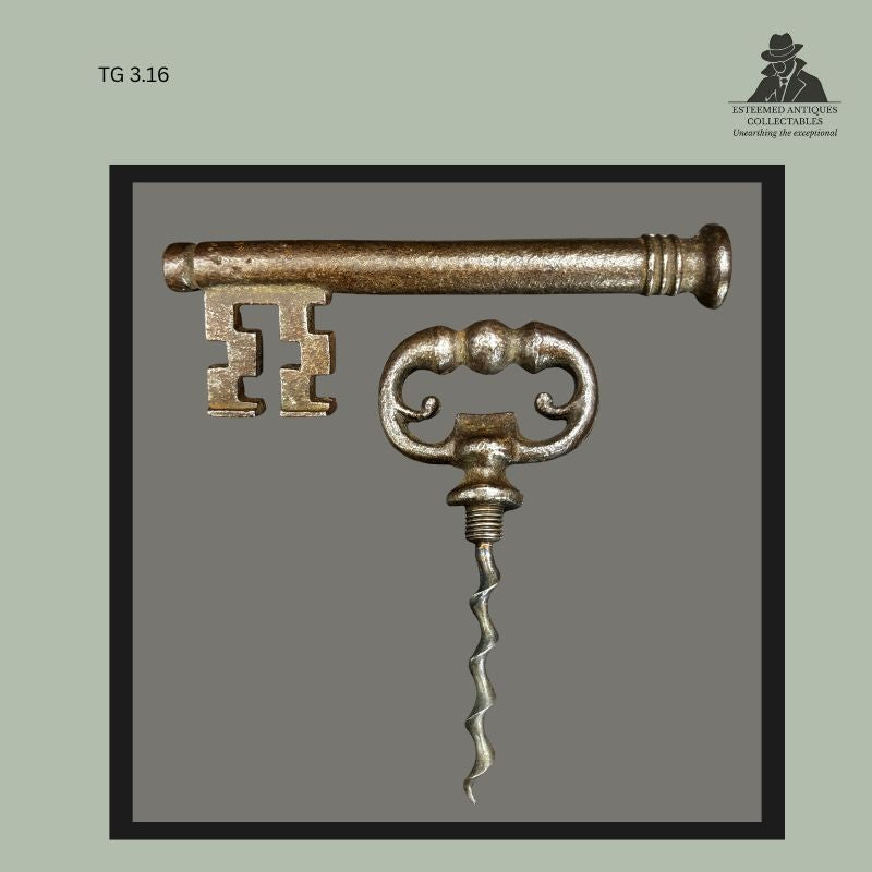 Cast metal key-form corkscrew with detachable barrel handle and decorative double-scroll finger grip, a compact pocket corkscrew combining key and wine-opening functions in a typical 19th-century novelty design from the Thomas Guenther Collection.