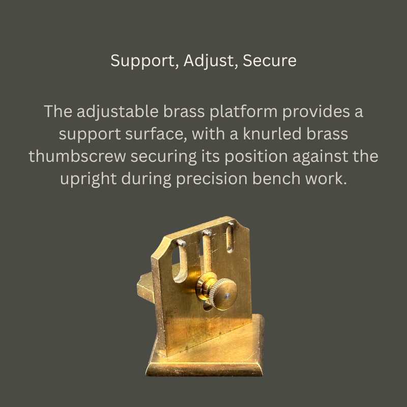 Rear view of a brass watchmaker’s adjustment jig showing a slotted upright, knurled locking thumbscrew, projecting support platform and rectangular base.