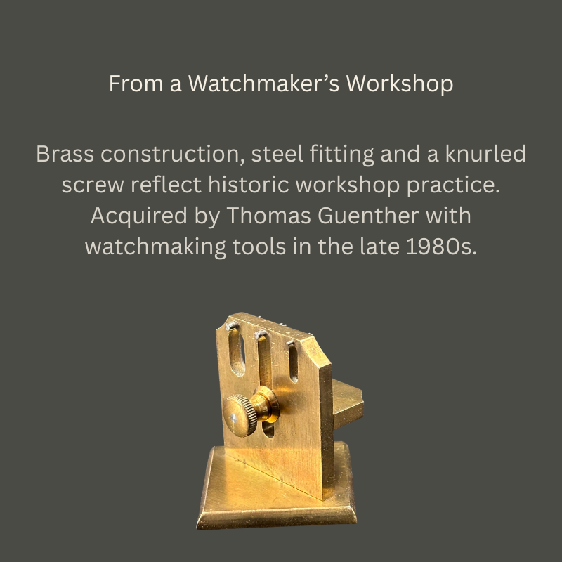 Brass watchmaker’s adjustment jig with slotted upright plate, knurled screw and square base, accompanied by text recording Thomas Guenther’s acquisition in the late 1980s.
