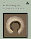 Heavy cast brass prestige anklet from West Africa with an open-cuff form, finely engraved concentric decoration and raised terminal ornamentation, traditionally worn as a symbol of status and wealth.