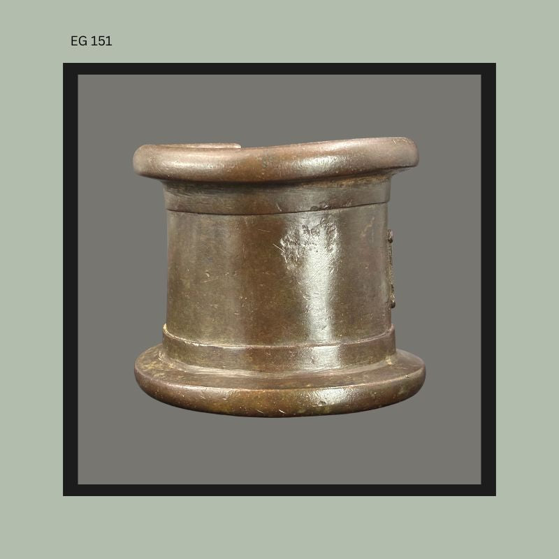 Heavy cast bronze West African anklet or bracelet with thick rounded terminal edges and dark aged surface patina, photographed from the side, from the Egon Guenther Collection.