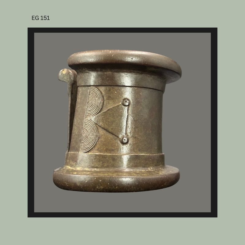 West African cast bronze anklet or bracelet with geometric incised decoration and projecting fastening element, possibly Senufo in origin, showing heavy cast construction and circular band form associated with ethnographic body adornment traditions.